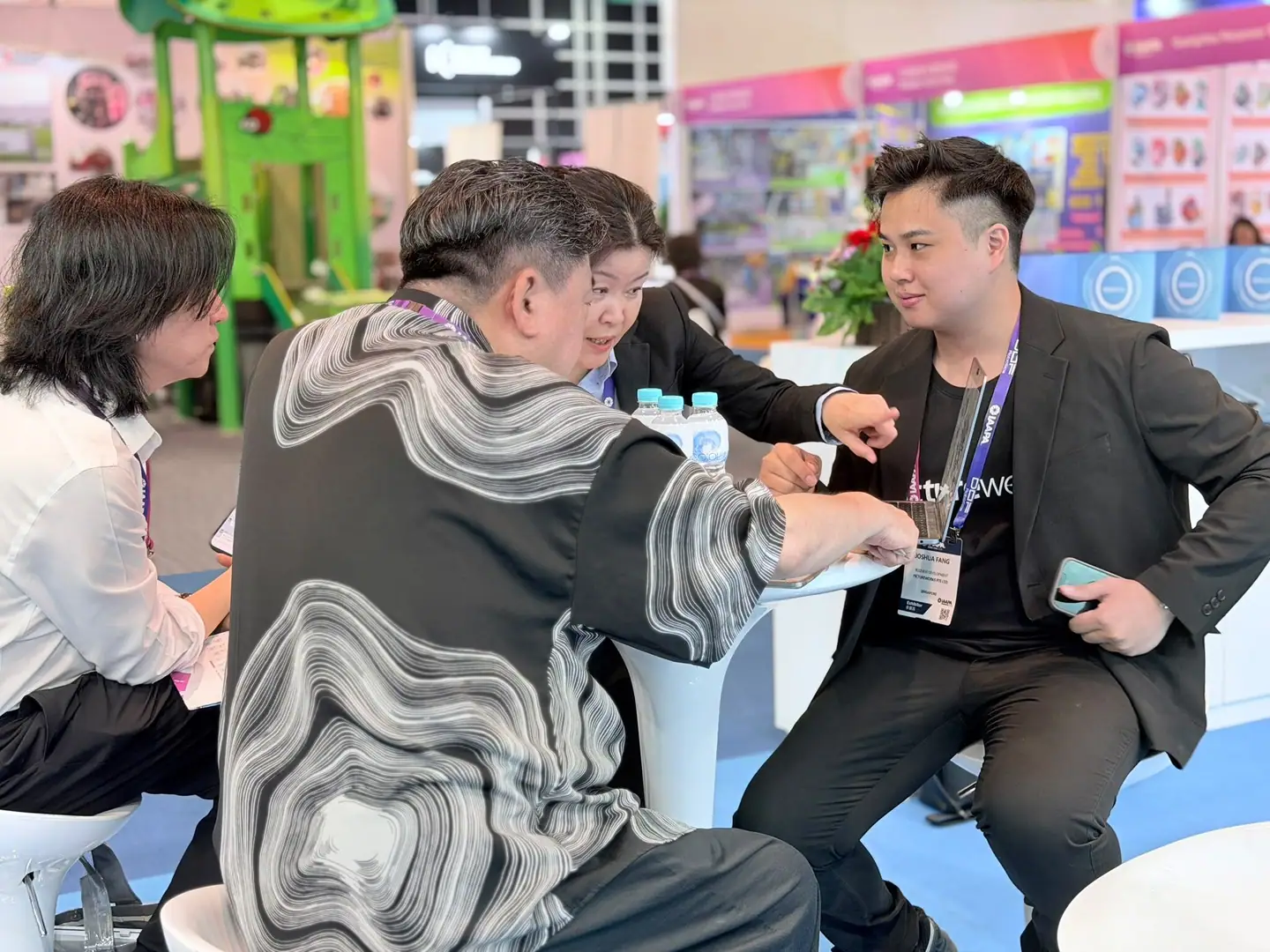 Pictureworks staff in conversation with visitors at the IAAPA Expo Asia 2026 stand