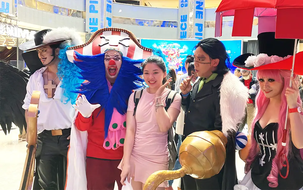 Guests meeting colourful characters at a touring exhibition